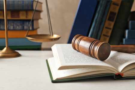 Wooden gavel, scales of justice and books on table. law conceptの写真素材