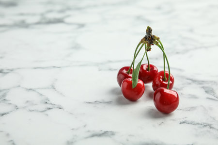 Sweet red cherry on marble tableの写真素材
