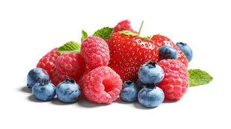 Raspberries, strawberries and blueberries on white backgroundの写真素材