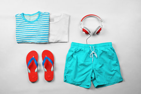 Flat lay composition with set of clothes and accessories on white backgroundの写真素材