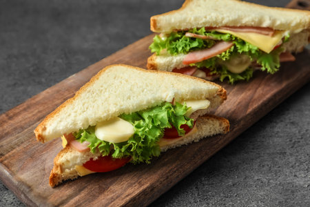 Tasty toast sandwiches on wooden board. Wheatbreadの写真素材