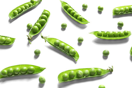 Delicious fresh green peas on white backgroundの写真素材