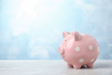 Pink piggy bank on table. money savingの写真素材