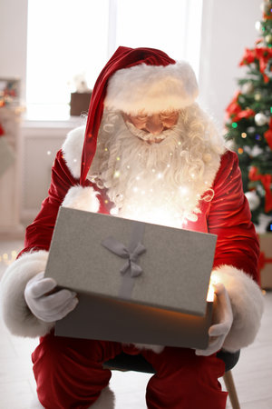 Authentic Santa Claus with gift box indoorsの写真素材