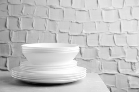 Stack of clean plates on tableの写真素材