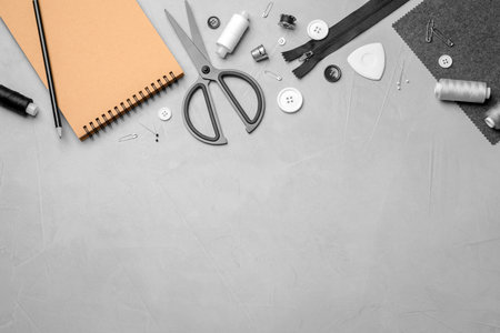 Flat lay composition with accessories for tailoring on tableの写真素材