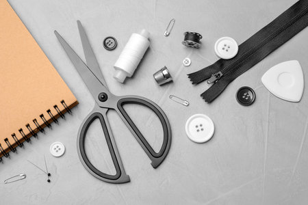 Flat lay composition with accessories for tailoring on table
