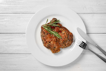 Plate with tasty grilled meat on table, top viewの写真素材
