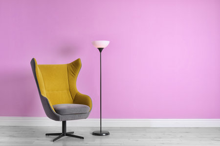 Comfortable armchair in stylish living room interior with space for textの写真素材