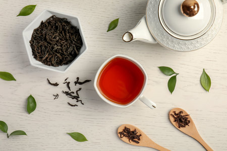 Flat lay composition with delicious tea on wooden backgroundの写真素材