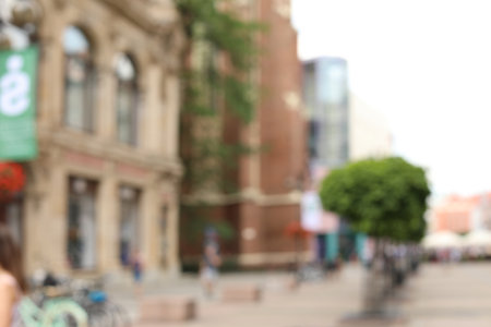 Blurred view of city street on sunny dayの写真素材