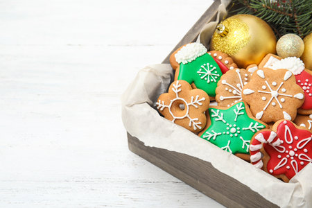 Crate with tasty homemade Christmas cookies on tableの写真素材