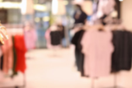 Blurred view of modern store with different clothesの写真素材