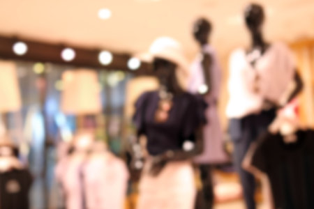 Blurred view of modern store with different clothesの写真素材