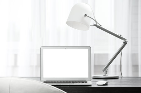 Laptop on desk in home office. Comfortable workplaceの写真素材