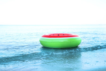 Colorful inflatable ring floating on sea water. summer holidays