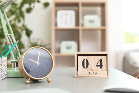 Stylish alarm clock on table in office. Time to work