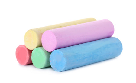Color pieces of chalk on white background