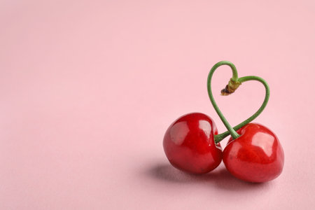 Sweet red cherry on color backgroundの写真素材