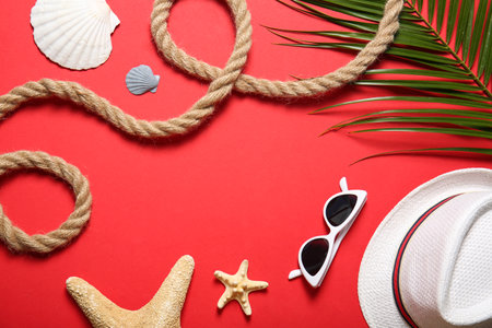 Flat lay composition with rope and beach objects on color backgroundの写真素材