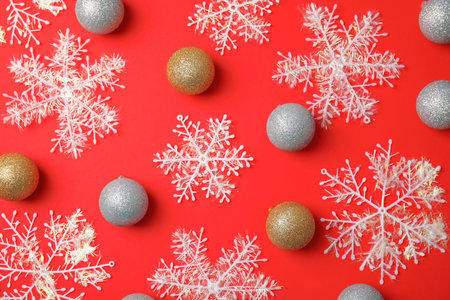 Flat lay Christmas composition with festive decor on color backgroundの写真素材