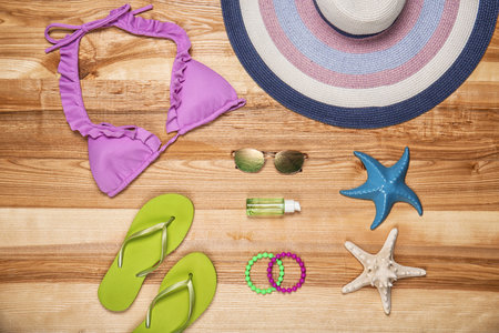 Flat lay composition with beach objects on wooden backgroundの写真素材