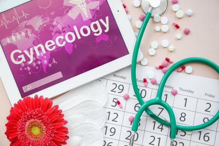 Flat lay composition with stethoscope, tablet and calendar on color background. Gynecological...