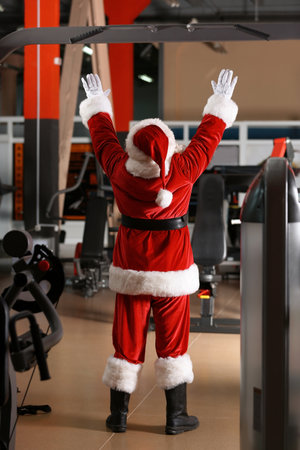 Authentic Santa Claus training in modern gymの写真素材
