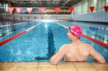 Young athletic man in swimming pool
