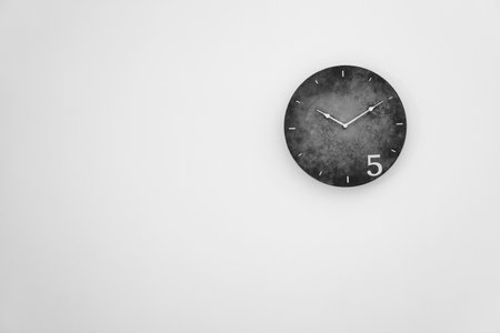 Analog clock hanging on the wall. Time of dayの写真素材
