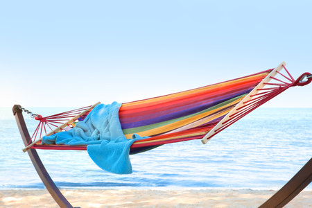 Colorful hammock with blanket at seaside. summer holidaysの写真素材