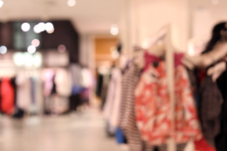 Blurred view of modern store with different clothesの写真素材