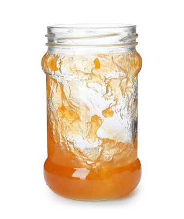 Jar with peach jam on white backgroundの写真素材