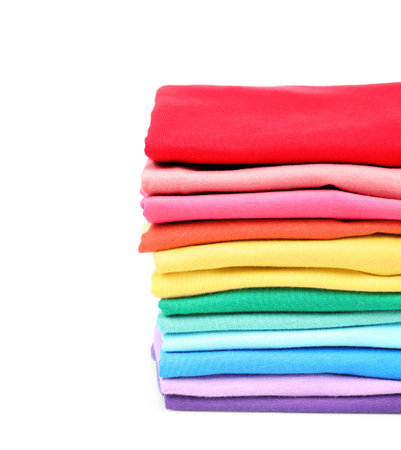 Stack of colorful t-shirts on white backgroundの写真素材