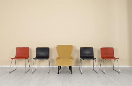Comfortable armchair and chairs indoors. interior decor elements