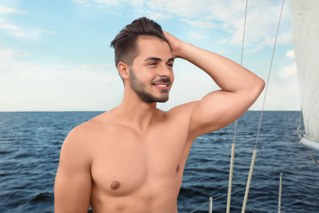 Young man resting on yacht at seaの写真素材