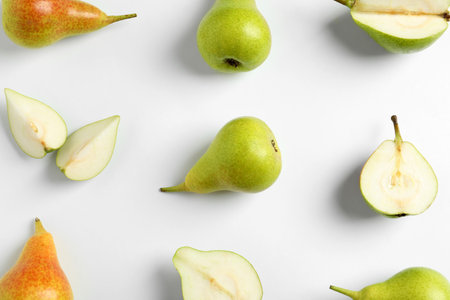 Fresh pears on light background, flat lay compositionの写真素材