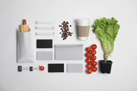Flat lay composition with items for mock up design on light background. food delivery serviceの写真素材