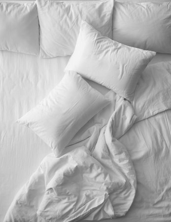 Soft pillows on comfortable bed, top viewの写真素材