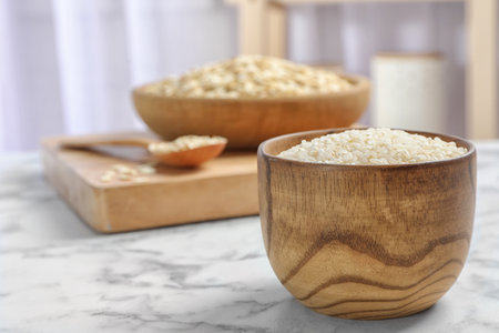 Bowl with rice on marble table. grains and cerealsの写真素材