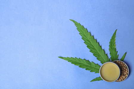 Flat lay composition with hemp lotion and space for text on color backgroundの写真素材