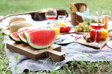 Blanket with food prepared for summer picnic outdoorsの写真素材