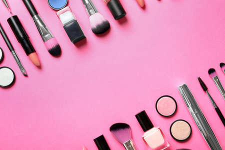 Flat lay composition with products for decorative makeup on pink backgroundの写真素材