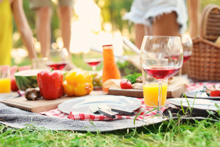 Blanket with food prepared for summer picnic outdoors, closeupの写真素材