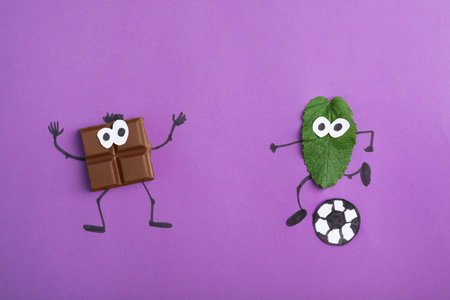 Creative flat lay composition with chocolate and mint on color backgroundの写真素材