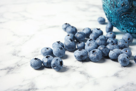 Fresh and juicy blueberries on marble tableの写真素材