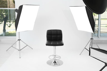 Interior of modern photo studio with chair and professional equipmentの写真素材