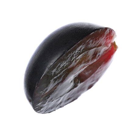 Half of fresh purple grapes on white backgroundの写真素材