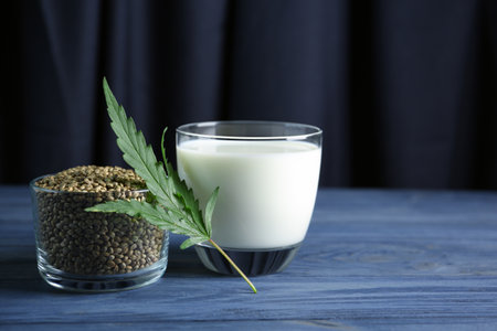 Composition with hemp milk and seeds on tableの写真素材