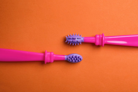 Manual toothbrushes for children on color background, top viewの写真素材